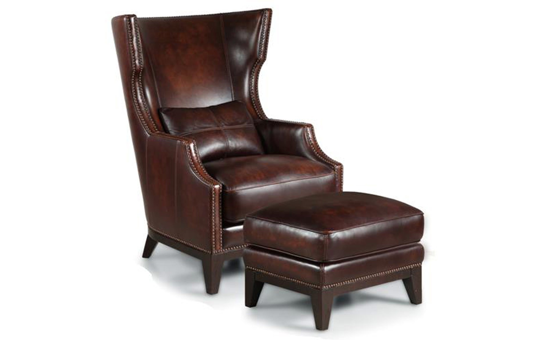 brown leather chair and ottoman