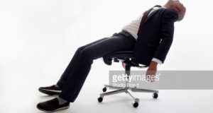 sleeping in a chair an exhausted businessman sleeping in an gettyimages
